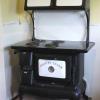 For Sale: Replica of Vintage 1930 Country Charm Wood Burning Stove/Oven  Converted to Electric (120-240 Volt). 
On the top there is a manual handle coffee grinder with timer clock > Working Condition.
